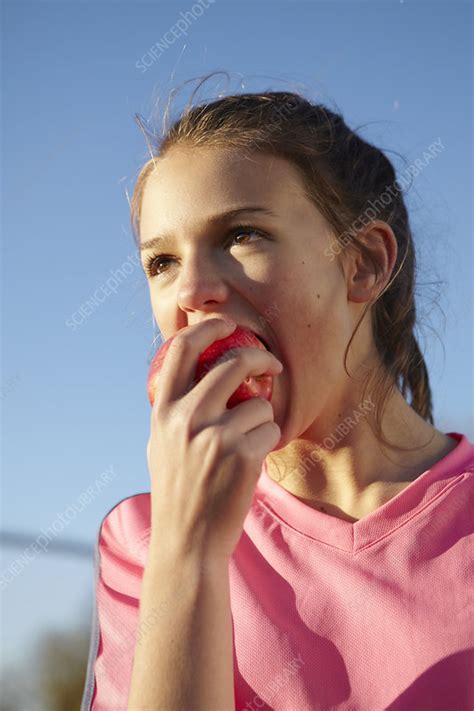 Girl Eating Apple Outdoors Stock Image F0067016 Science Photo Library