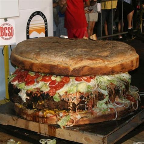 The biggest person in the world is robert waslow who is 8ft 11 and weighed at a whoping 439 pound, he died by a blister on his foot. World's Largest Burger | Big burgers, Food, Man vs food