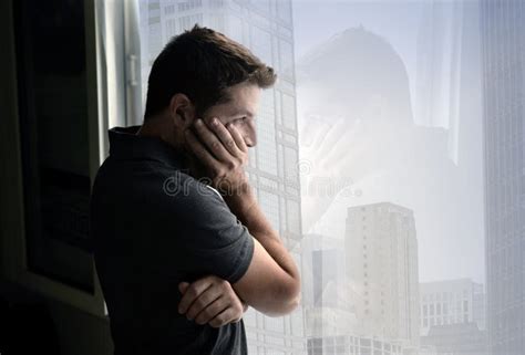 Attractive Man Looking Through Window Suffering Emotional Crisis And