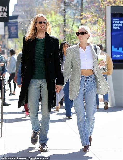 Elsa Hosk Flashes Bare Midriff In White Crop Top As She Holds Hands