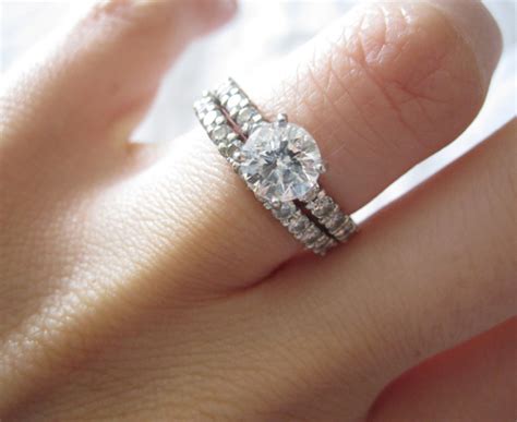 An engagement ring and wedding band receive less wear than if worn on the dominant hand. How to Wear a Wedding Ring Set the 'Right' Way Blog