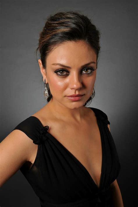 brunette stunner mila kunis displaying her cleavage in a modest dress team celeb