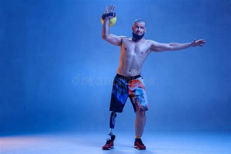 Athlete Disabled Amputee Isolated On Blue Studio Background Stock Image