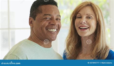 Close Up Of Laughing Mixed Race Couple Turning To Camera Stock Video