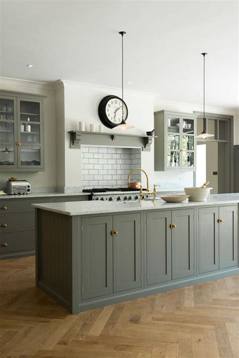 Check out our kitchen cabinet selection for the very best in unique or custom, handmade pieces from our home & living shops. Muted grey cabinets, aged brass hardware | Kitchen design ...