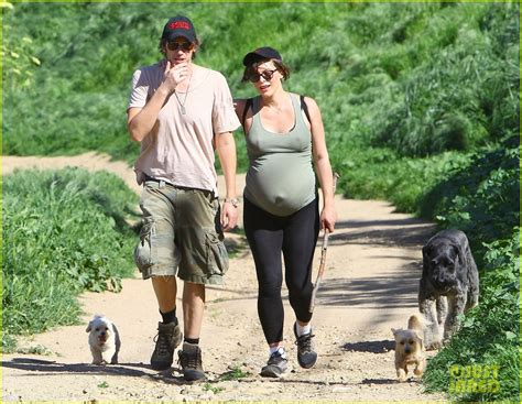Pregnant Milla Jovovich Shows Off Her Growing Baby Bump While Rocking