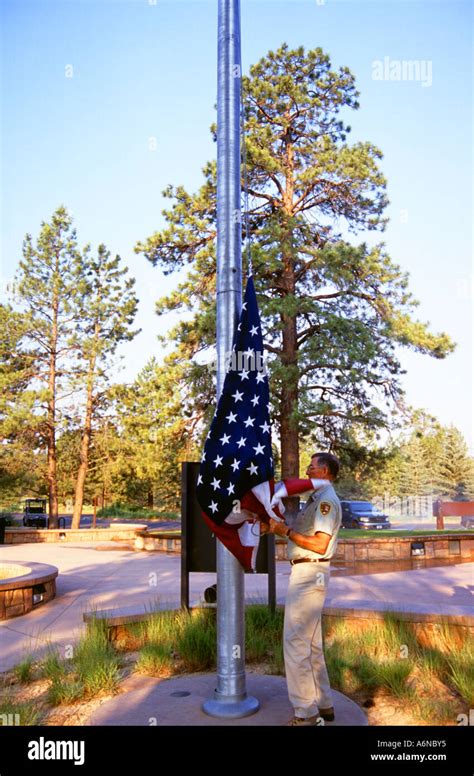 Ranger Raising The Us Flag In Bryce Canyon National Park Utah Usa Stock