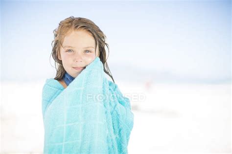 Smiling Girl On Beach Wrapped In A Towel Beach Towel One Girl Only Stock Photo