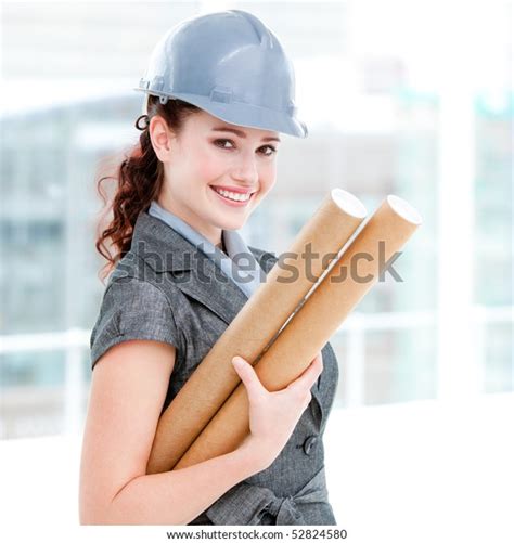 Portrait Smiling Female Architect Holding Blueprints Stock Photo Edit