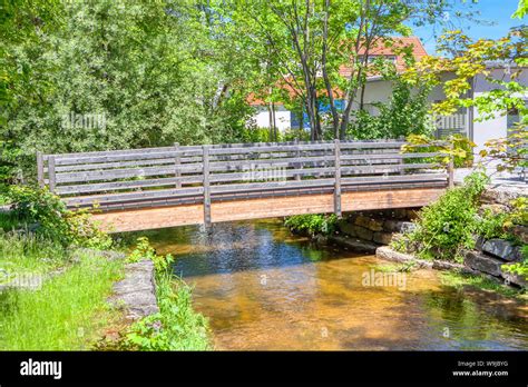 Pedestrian Wooden Bridge Over A Small River Stock Photo Alamy