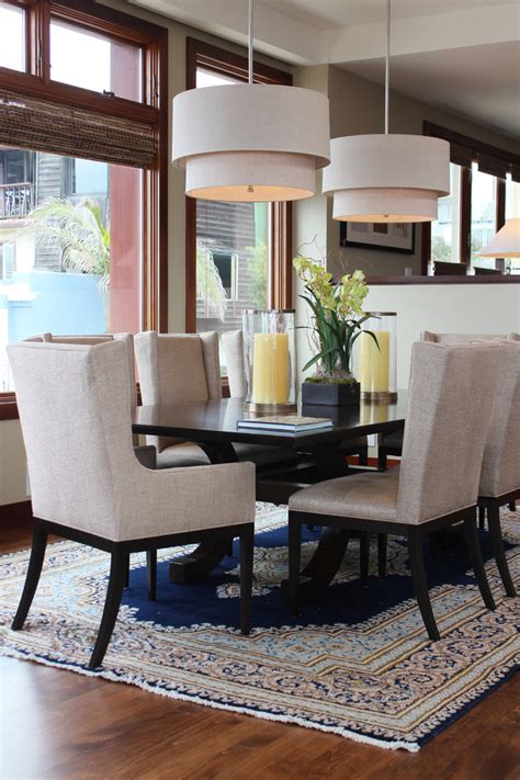 The dining table, preparation table and chairs are nice complement to the blue cabinets. Cool wingback dining chair in Dining Room Beach Style with ...