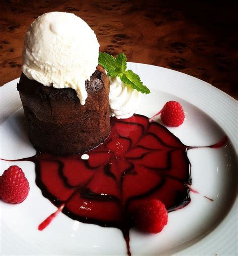 Dessert is also great for dinner parties because it's almost always a great option for preparing ahead of time. love chocolate cake with vanilla infused gelato swimming in raspberry puree. | Fine dining ...