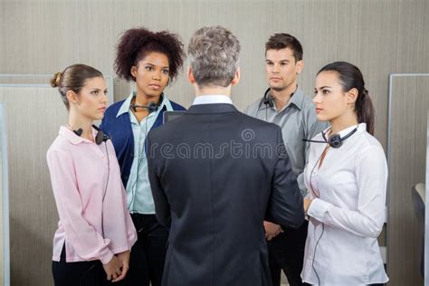 Manager Discussing With Serious Employees Stock Image Image Of