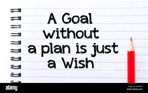 A Goal Without A Plan Is Just A Wish Text Written On Notebook Page Red