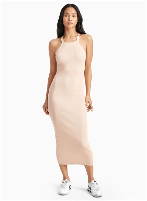 A Body Hugging Dress Thats Confident On Its Own But Easily Layered This Style Features A