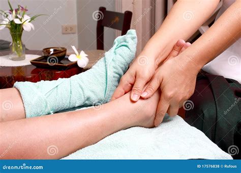 Masseur Giving Lady Patient A Leg Massage Stock Photography