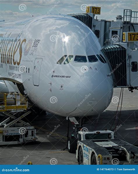 Emirates Airbus A380 800 And Pushback Tractor Editorial Stock Photo