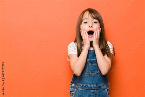 Surprised Little Girl In A Studio Stock Photo Adobe Stock