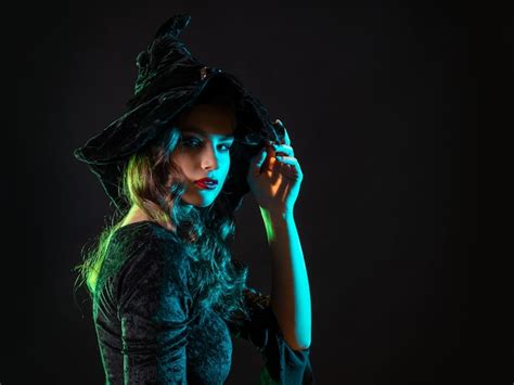 Premium Photo A Witch Creates Magic A Young Beautiful Brunette In A