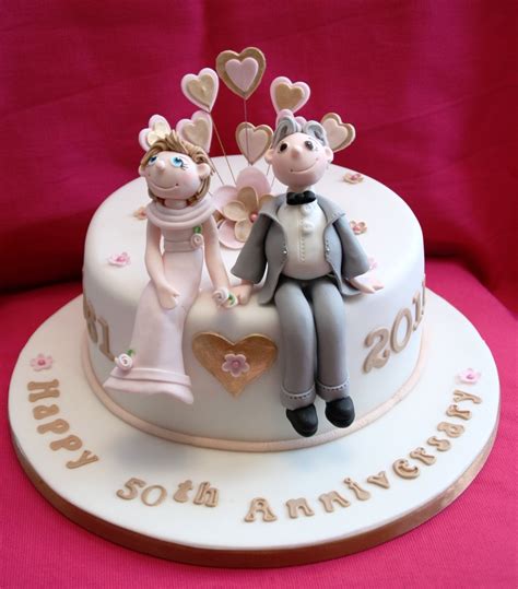An1 stacked anniversary cake w/single layer heart this cake requires that the order is finalized at least one week in advance of the date required. Order Couple Anniversary Cake, Online Couple Anniversary ...