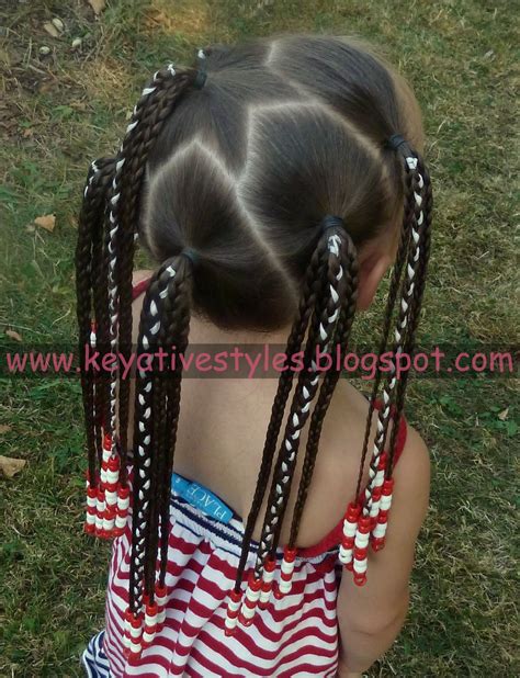 Dutch braids are coiled into side buns and decorated with thin golden ribbon in this example. Keyative Styles: 9/11 REMEMBRANCE: STAR PART + RIBBON ...