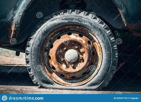 An Old Flat Tire On A Rusty Car Stock Image Image Of Side Wheel