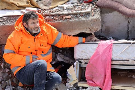 Grieving Dad Holds Hand Of Dead Daughter Crushed Under Rubble Following