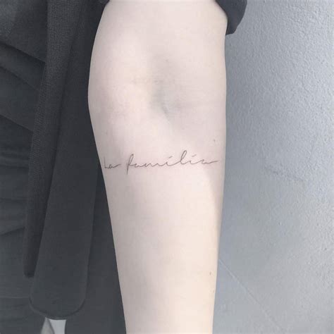 La Familia Lettering Tattoo On The Inner Forearm
