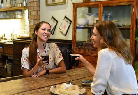Two Best Friends Talking And Eating In A Cafe Stock Image Image Of