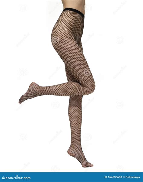 Legs With Black Fishnet Tights Isolated Over White Background Stock