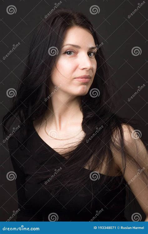 a brunette girl in black dress with with long straight hair stock image image of hair face