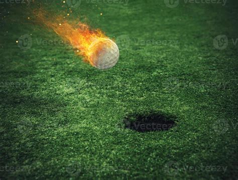 Fiery Golf Ball Near The Hole In A Grass Field 20553940 Stock Photo At