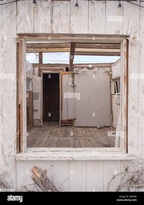 Weathered Broken Room Of Abandoned Roofless Cabin Located Behind Square