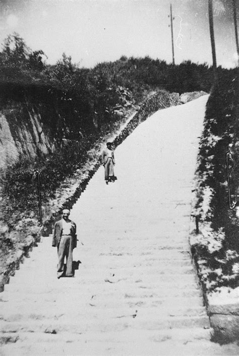 The ss guards invented competitions betting on which prisoner would make it to the top first. Two survivors pose on the stone "steps of death" (Todesstiege) in the Mauthausen Wiener Graben ...