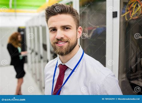 Smiling Technician Standing In A Server Room Stock Image Image Of