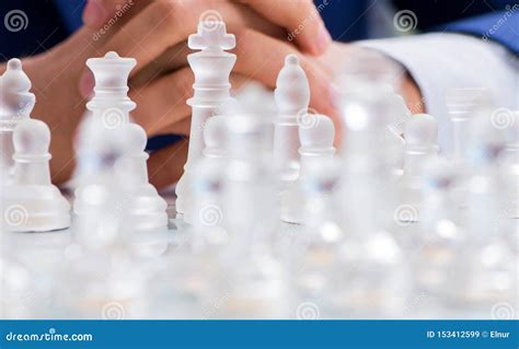Young Businessman Playing Glass Chess In Office Stock Image Image Of