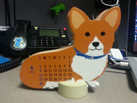 A Desk Calendar With A Corgi Dog On It