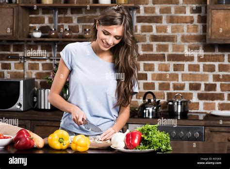 Woman Cooking Dinner Stock Photo Alamy