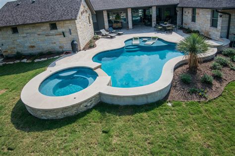 ~ happy tubs is the best jacuzzi repair company in the area! Freeform pool design with travertine deck and lueder ...