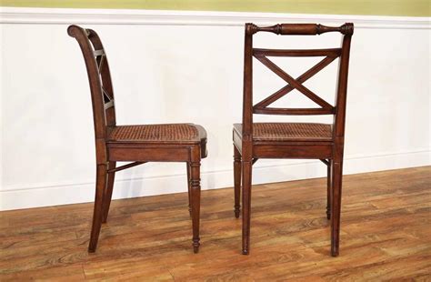 Maybe you would like to learn more about one of these? Solid Walnut Antique Reproduction Cane Seat Dining Chair