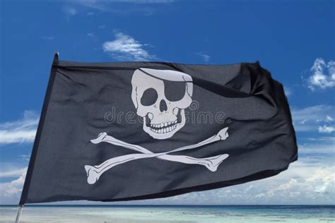 Waving Pirate Flag Jolly Roger On Tropical Island Background Stock