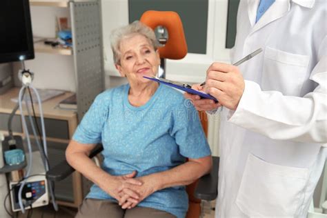 Senior Woman Visiting Otolaryngologist In Clinic Stock Photo Image Of