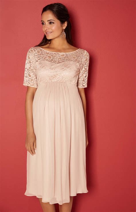 With A Beautifully Fitted Sweetheart Bodice With Soft Scoop Neck And Pretty Elbow Length Sleeves