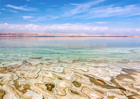 The dead sea lies at the lowest point of dry land on earth, more than 1,300 feet below sea level. How to visit the Dead Sea in Jordan
