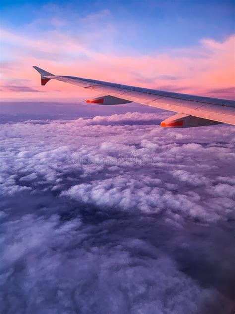Wing Of An Airplane At Sunset Stock Image Image Of Orange Flight
