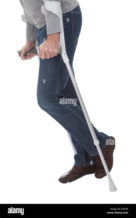 Senior Man Walking Using Crutches Isolated On White Stock Photo Alamy