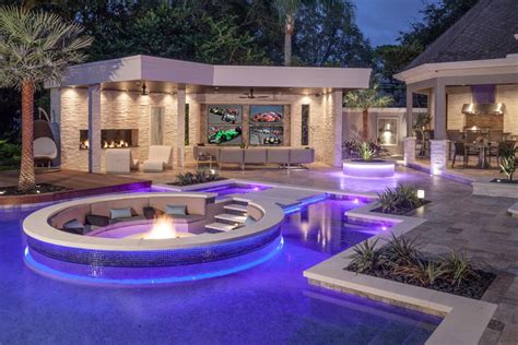Tropical Pool With Sunken Fire Pit Seating Area Hgtv Ultimate Outdoor
