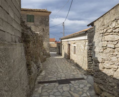Old Narrow Street With Stone Traditional Houses And Paving At Village