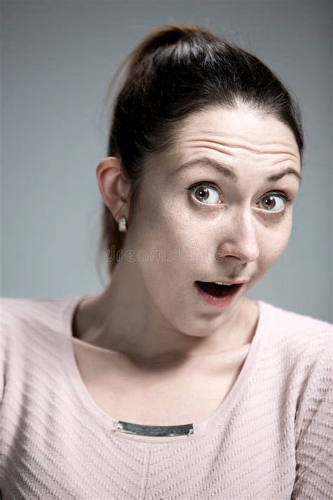 Portrait Of Young Woman With Shocked Facial Expression Stock Image