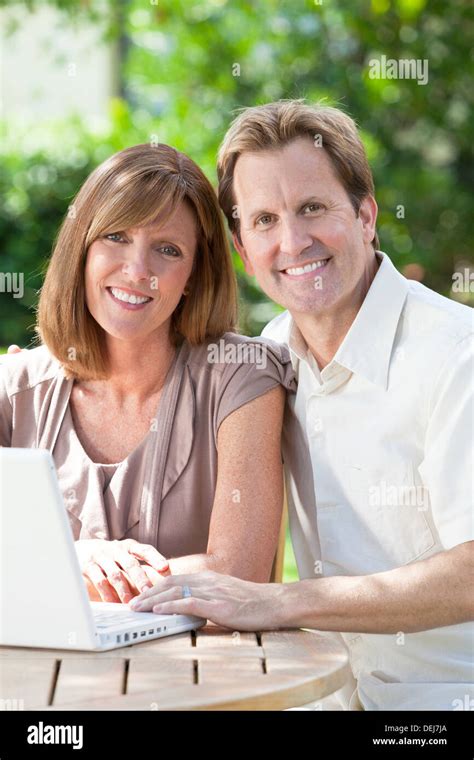 Attractive Successful And Happy Middle Aged Man And Woman Couple In